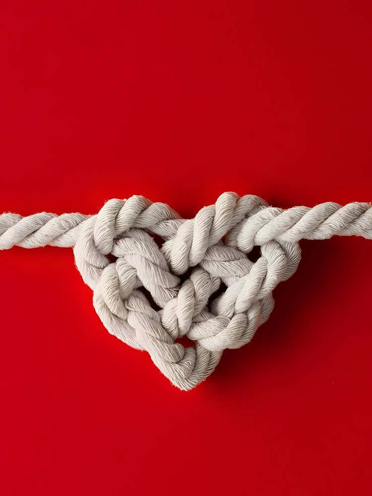 Heart Knot On Red Background