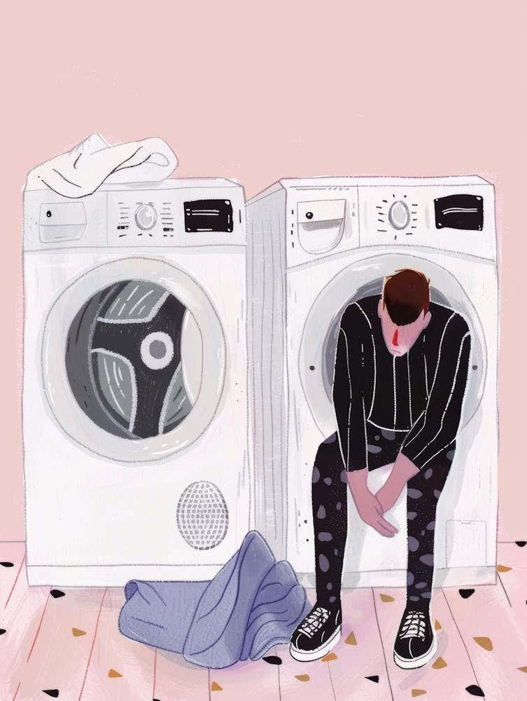 Man Sitting In Front Of Washing Machine 1