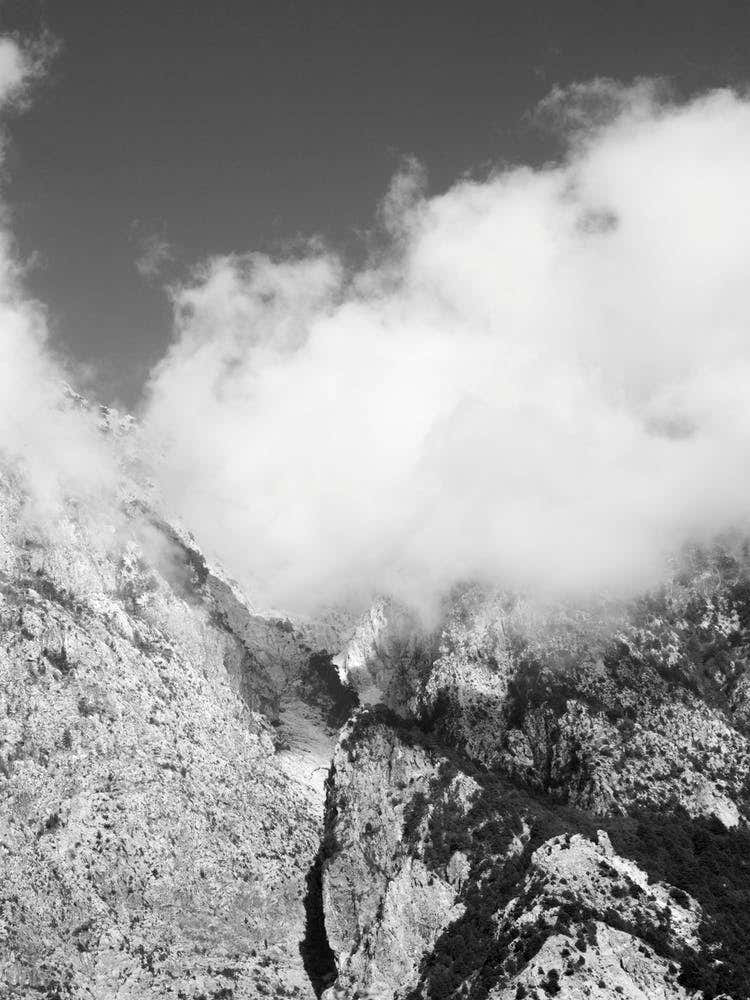 Hiking Through Mountains And Clouds