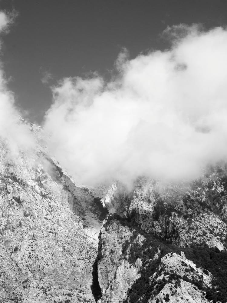 Hiking Through Mountains And Clouds