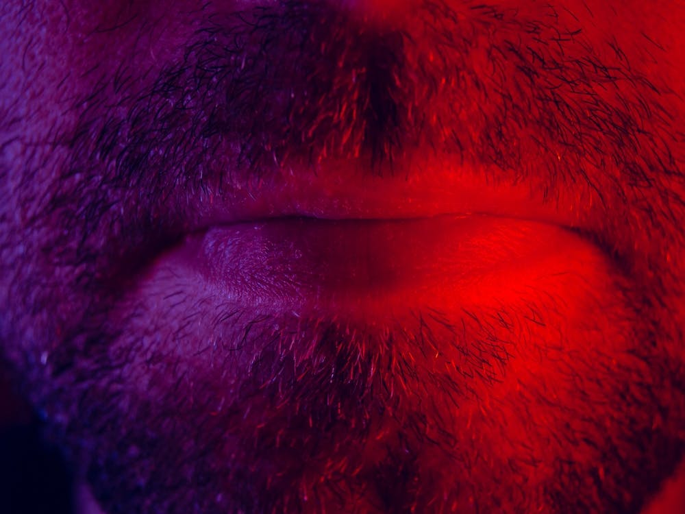 Macro Close Up On Man Mouth With Serious Facial Expression