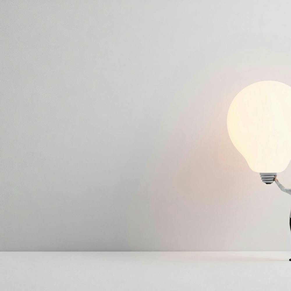 Businessman Holding A Light Bulb