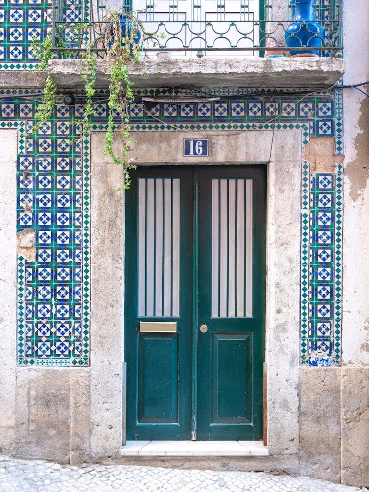 The green door nr. 16 in Alfama, Lisbon, Portgual with retro azulejos - summer vintage street and travel photography by Christa Stroo Photography