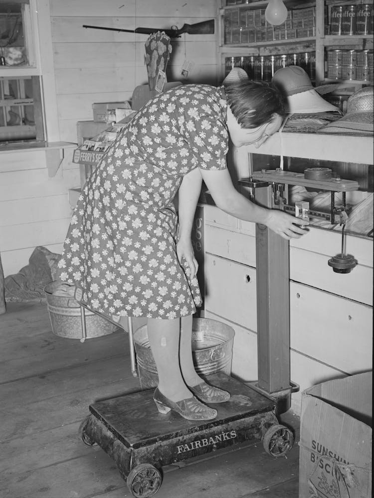 Weighing On The Scales In The General Store, Pie Town, New Mexico By Russell Lee