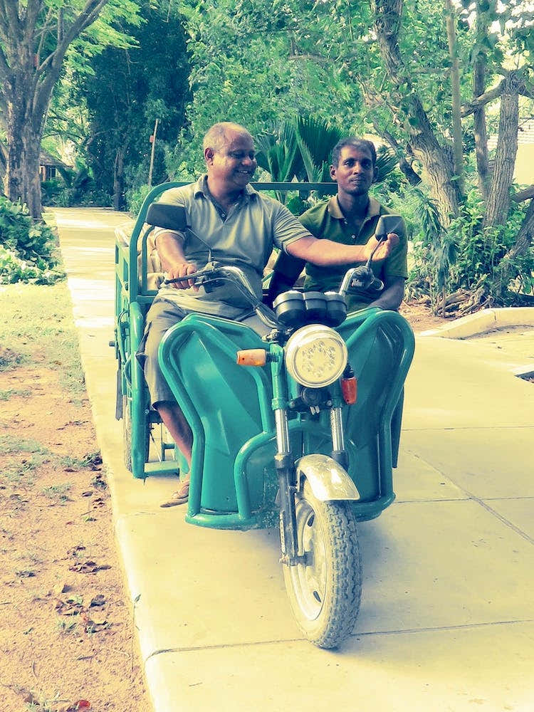 Two Men On A Motorcycle Maldives
