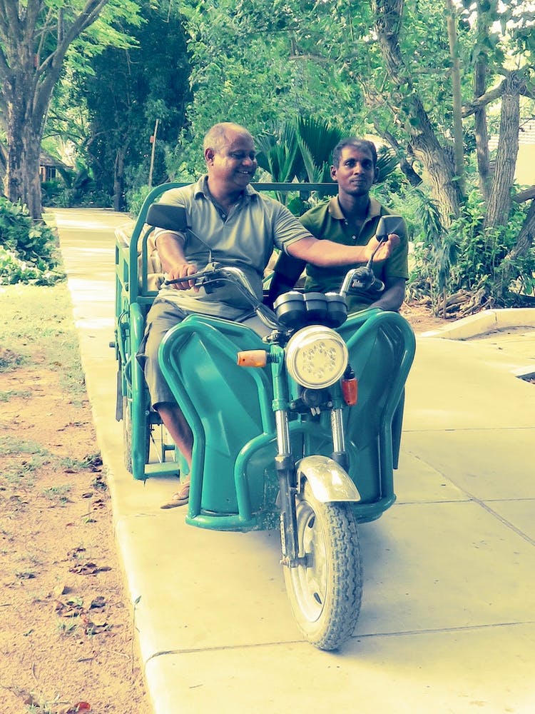 Two Men On A Motorcycle Maldives