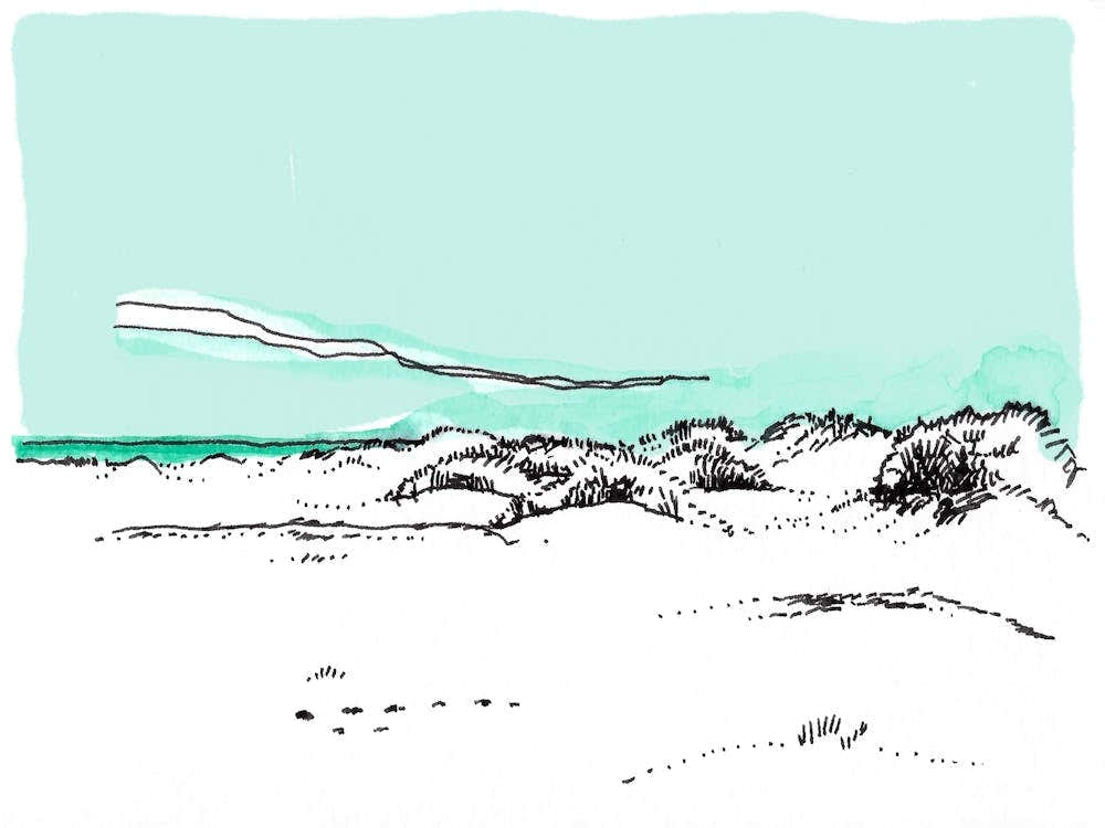Sand Dunes Under A Blue Sky