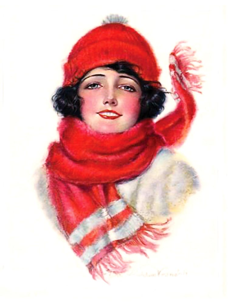 Portrait Of A Smiling Young Woman In Winter cap And A Shawl