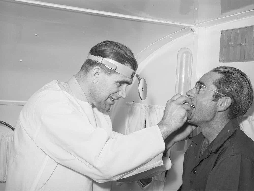 Doctor And Farm Workers At The Fsa (Farm Security Administration) Migratory Labor Camp Mobile Unit, Wilder, Idaho