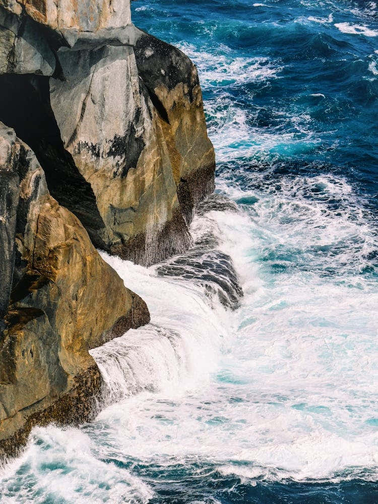 Ocean Surf And Rocky Shore