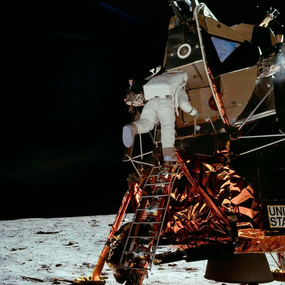 Astronaut Edwin E Aldrin Jr, Lunar Module (Lm), Pilot Descends From The Lm, Climbing Down The Ladder