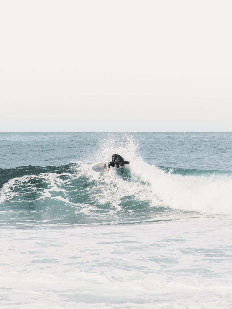 Surfer Catching A Wave
