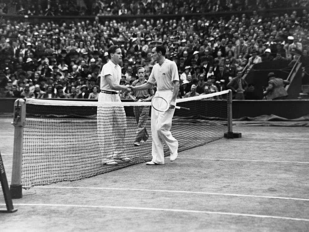 Fred Perry and Gottfried von Cramm of Germany shake hands at the net after the Mens Wimbledon finals