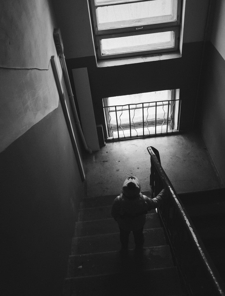 Figure Standing On A Staircase