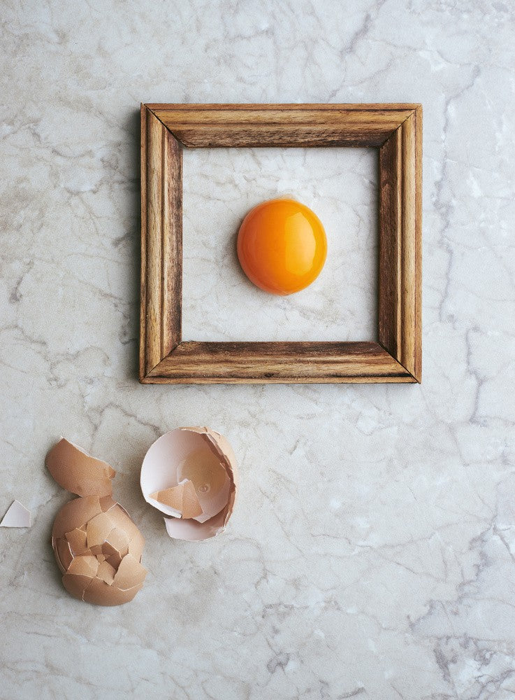 Yolk Framed By A Wooden Frame
