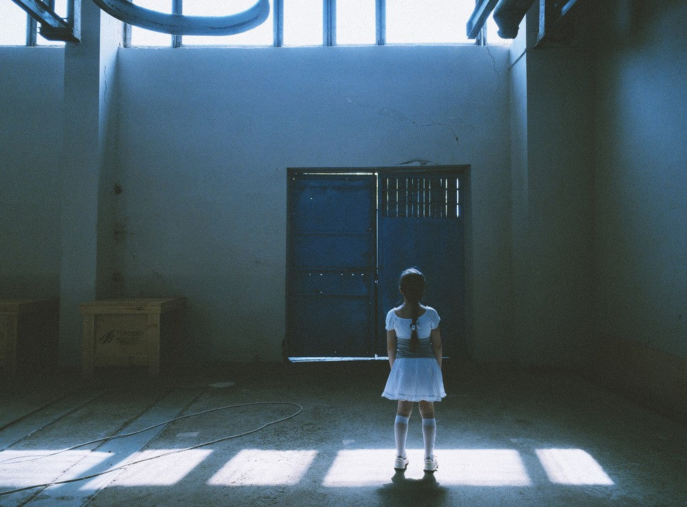 A White Dress Stands In An Empty Room