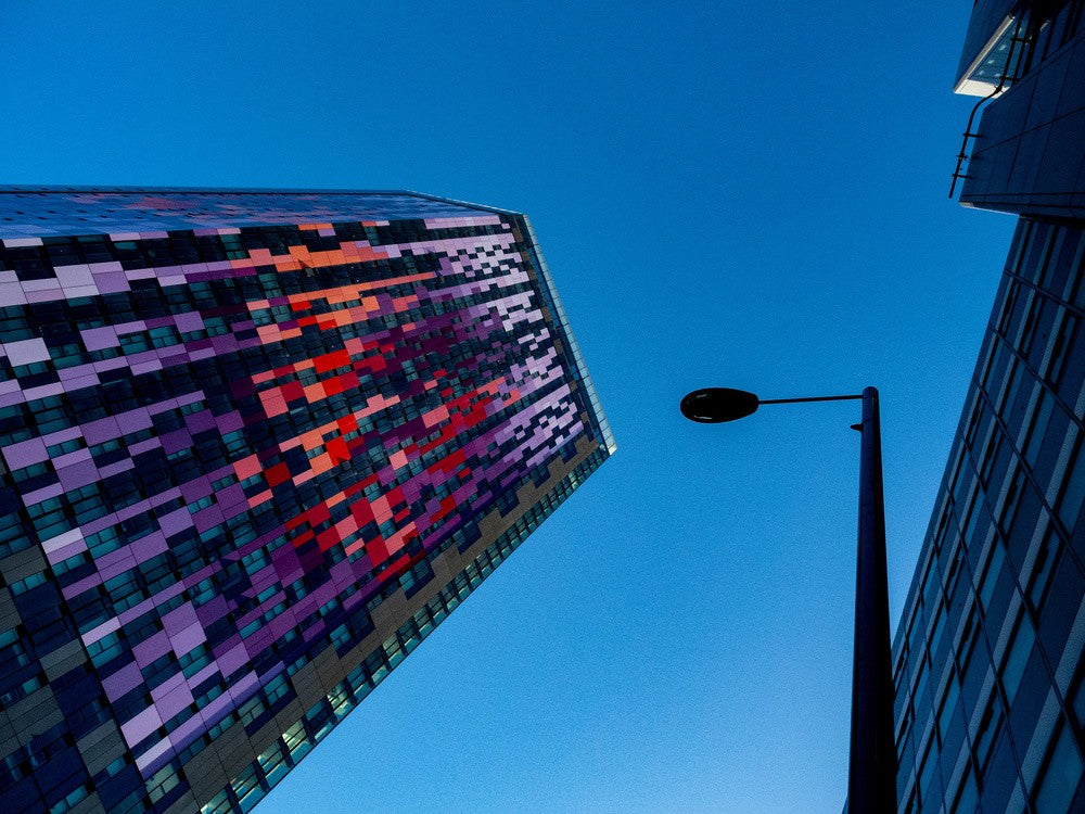High above the streets and houses.