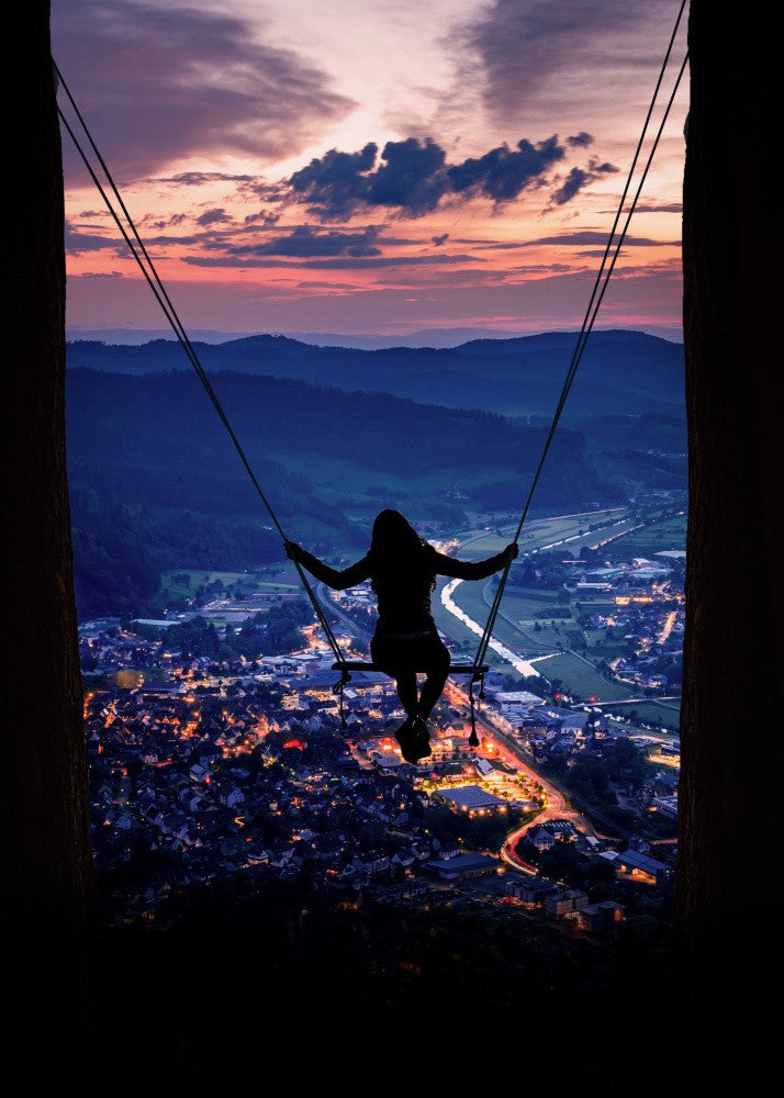 Silhouette Of A Woman On A Swing