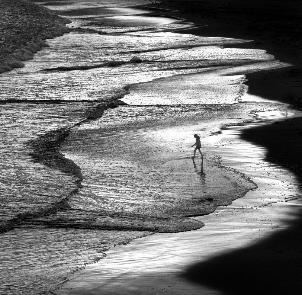 Girl Walking On The Beach