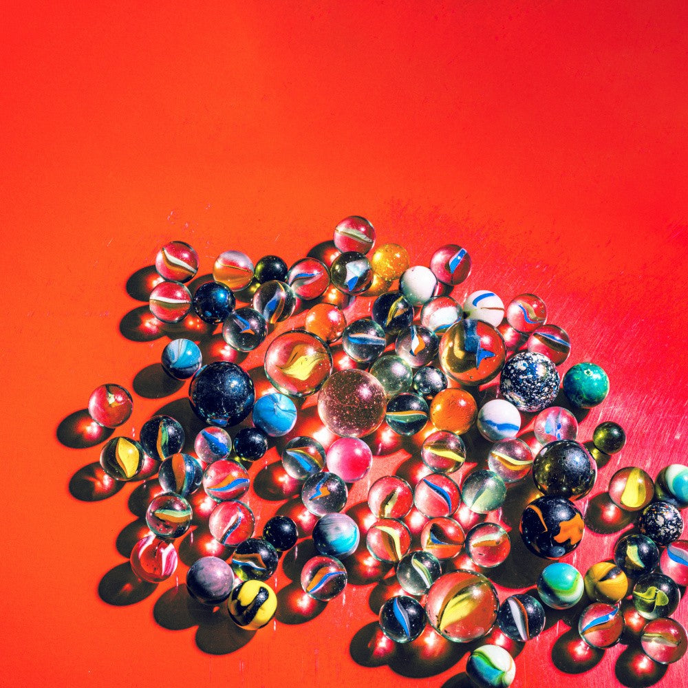 Marbles on vibrant red
