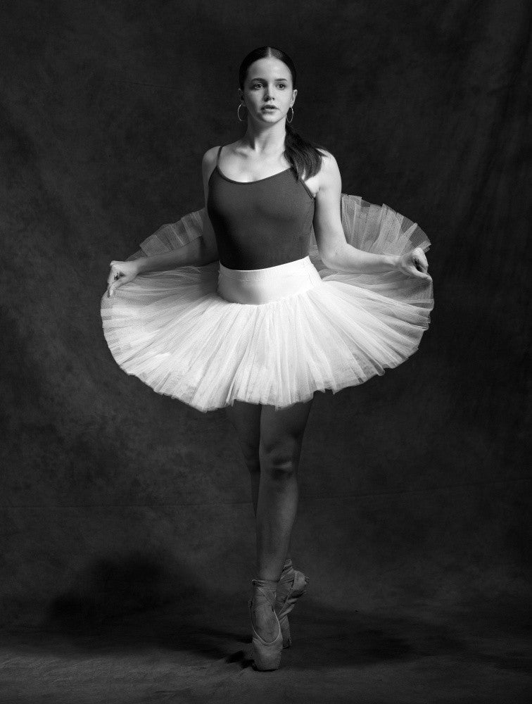 Holding her skirt