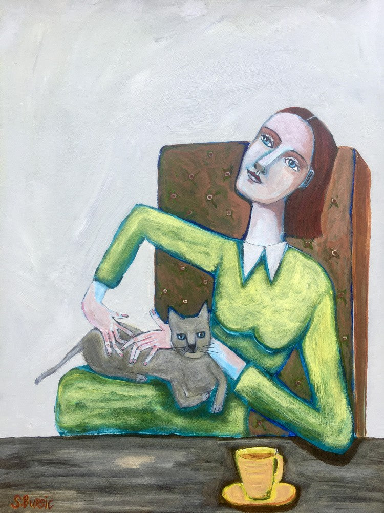 Lady tickling grey cat in chair