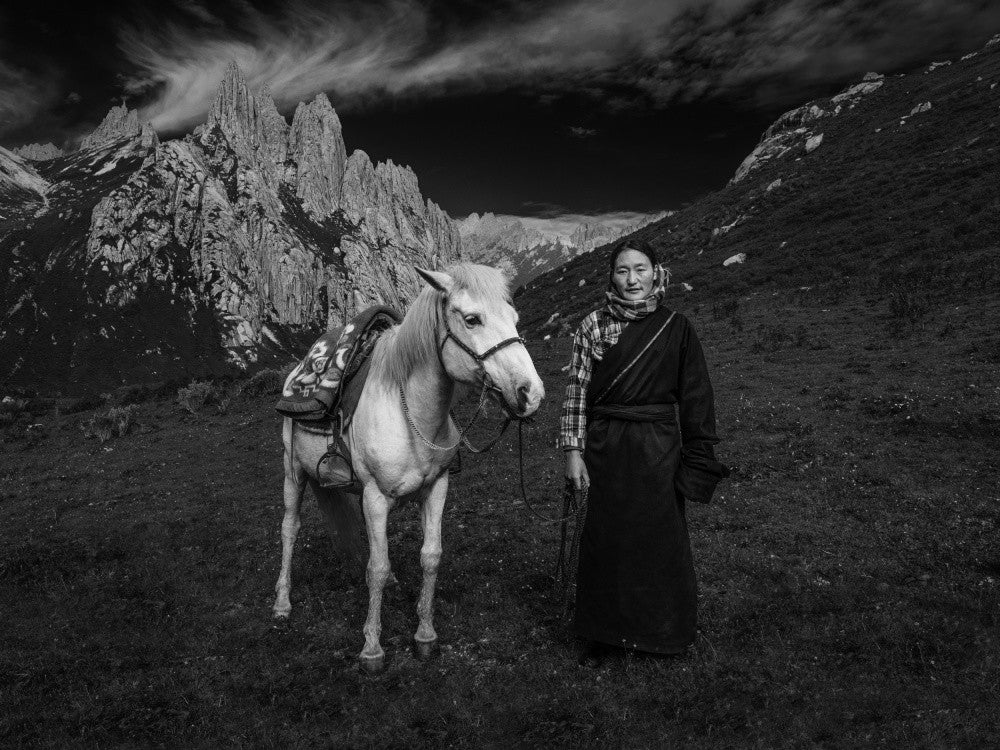 A Tibetan Woman and Her Horse
