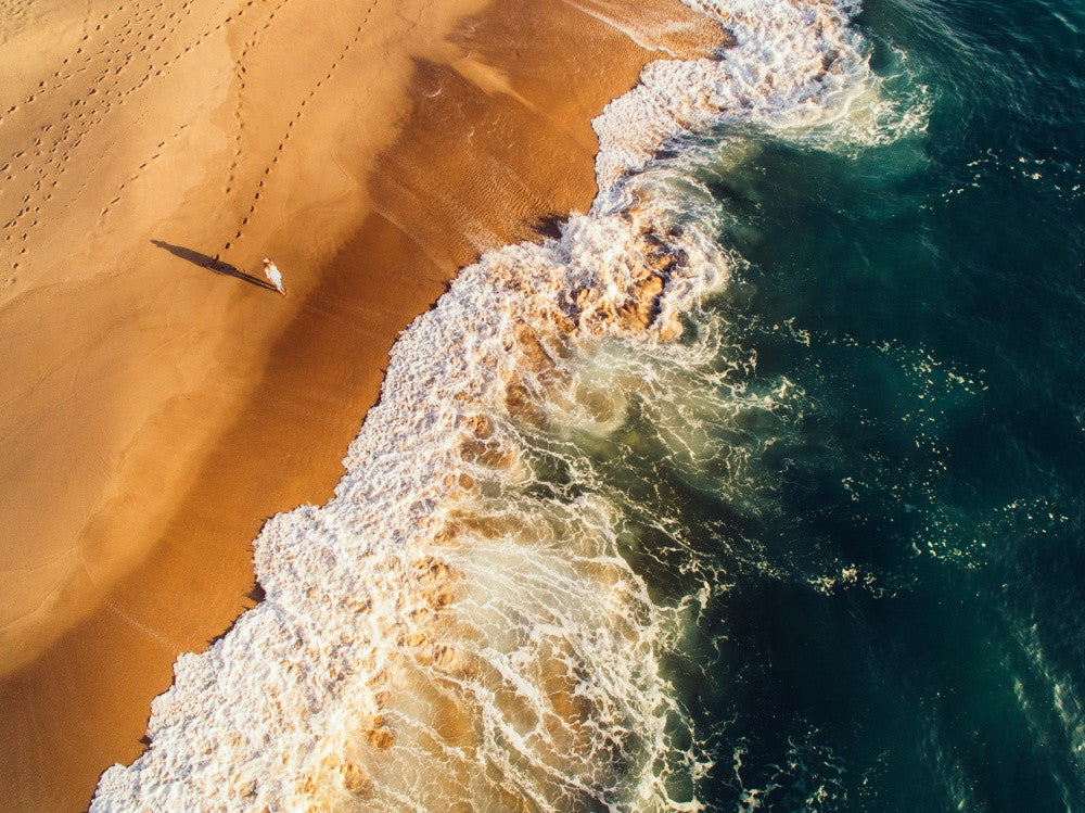 Beach With Golden Sand Meeting Vibrant Azure Waves