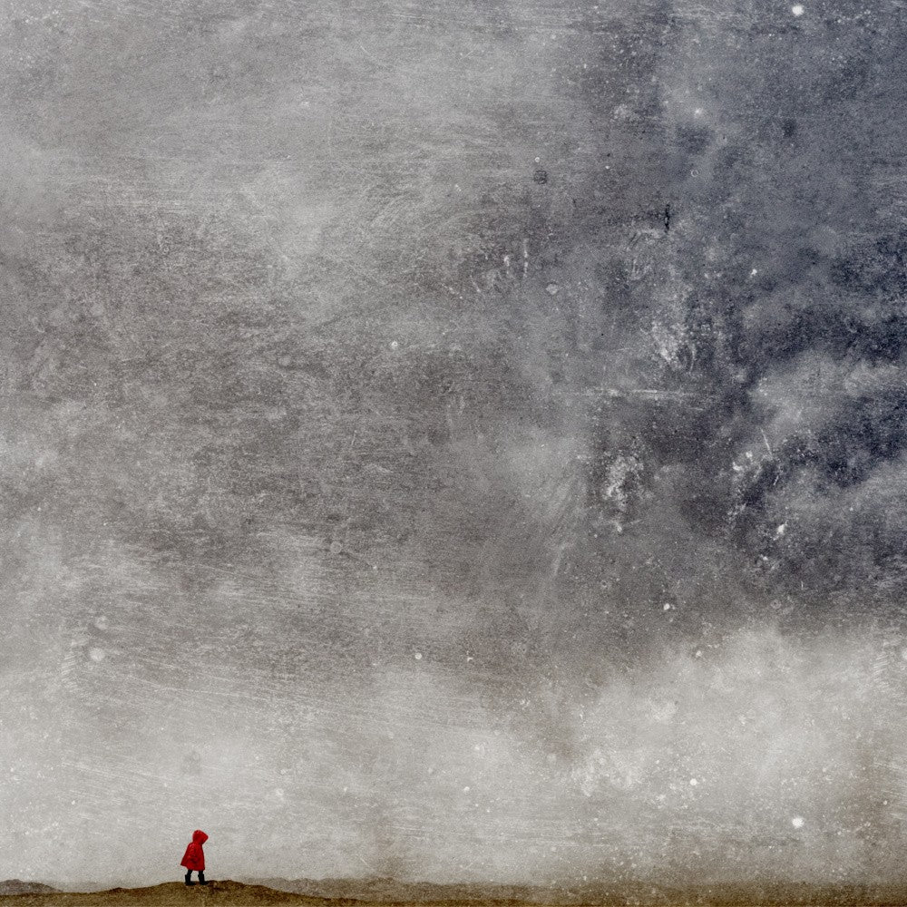 Red Coat Walks Across A Vast