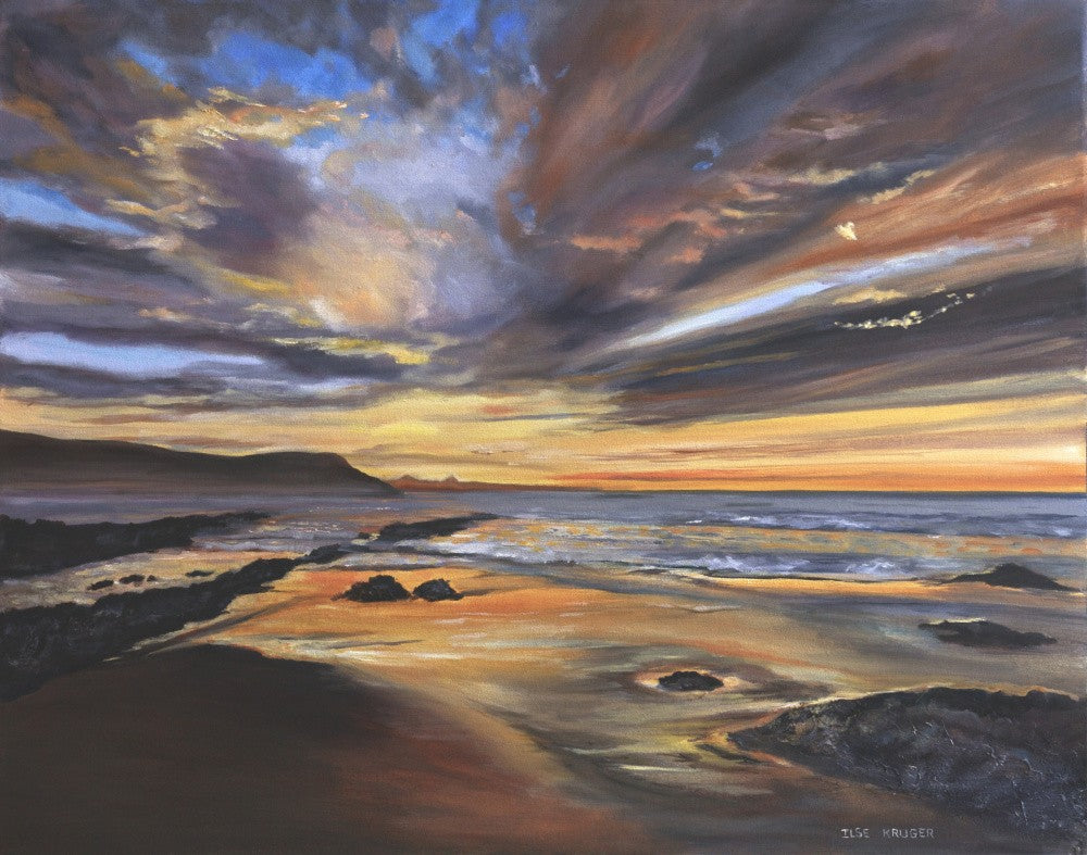 Serene Sunset over a Rocky Beach