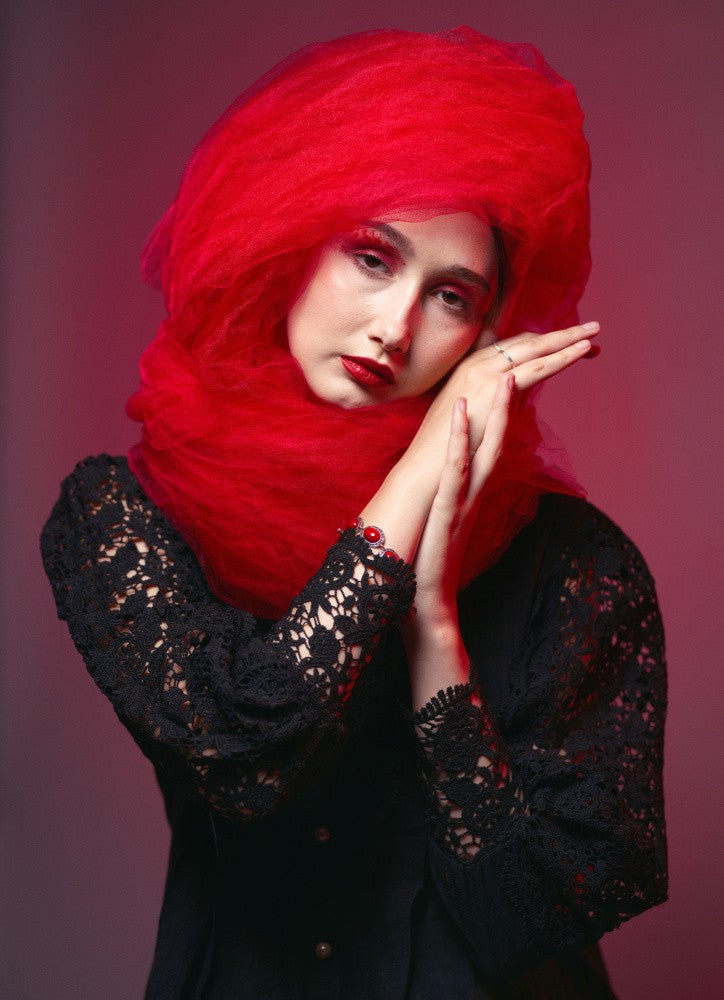 With a red headdress