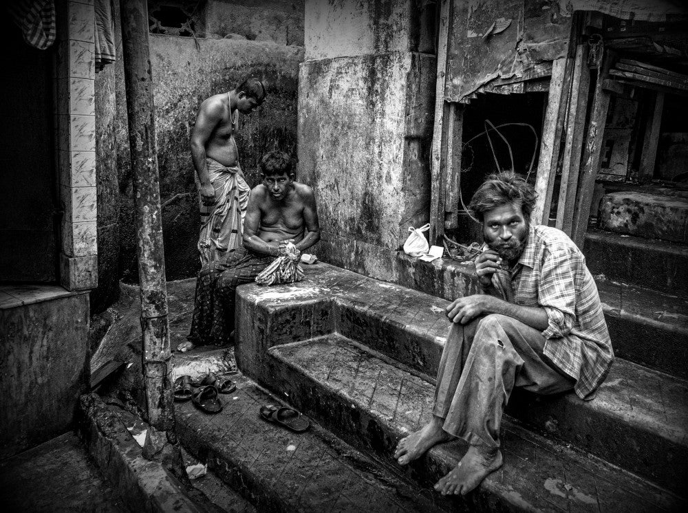 Three men in the streets of Kolkata (India)