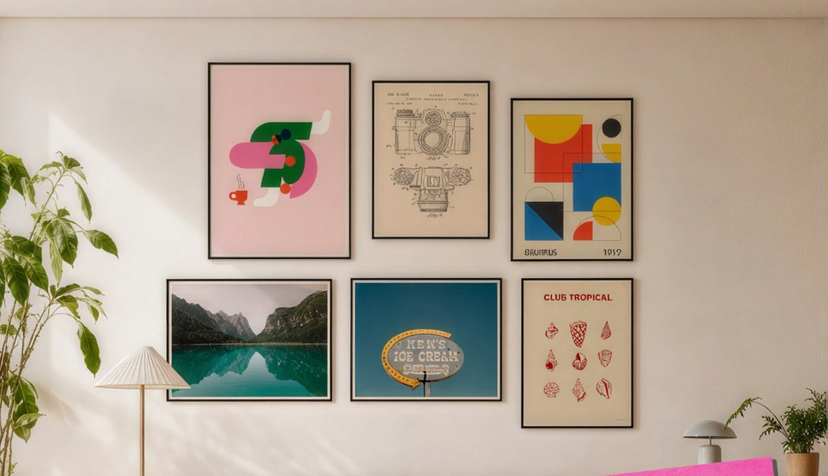 Gallery wall of six framed prints above a cream sofa in a bright living room