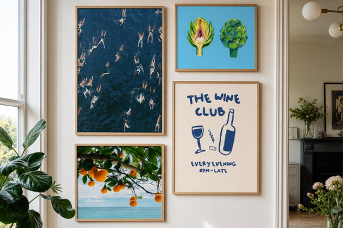Kitchen gallery wall with aerial swimmers, artichokes and a wine club print