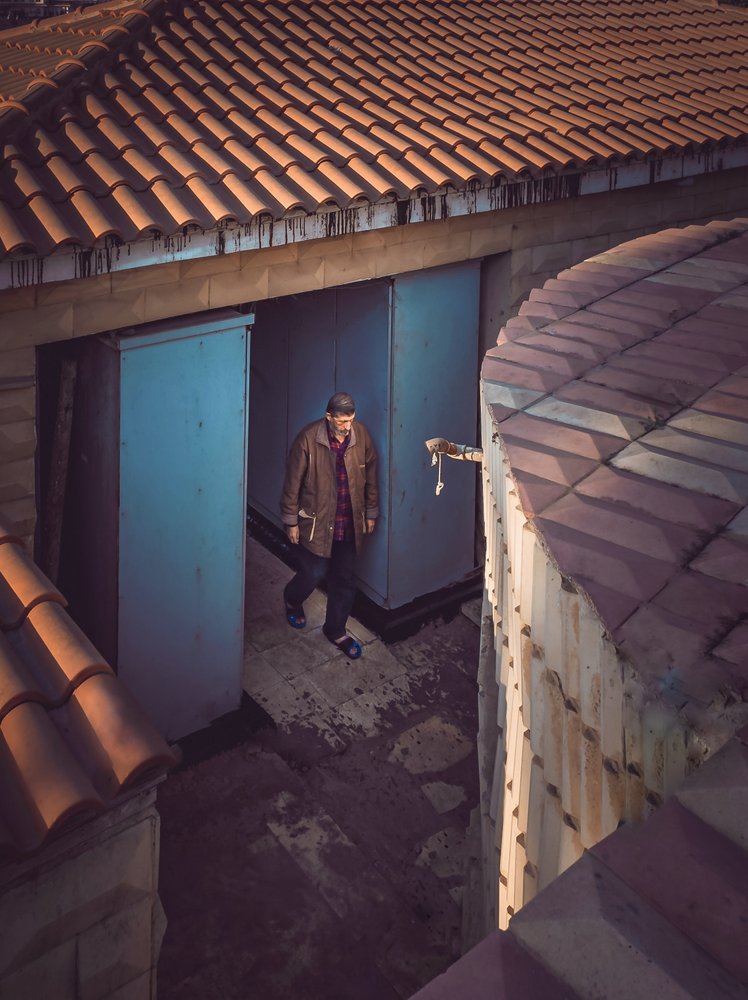 Man In Rustic Doorway