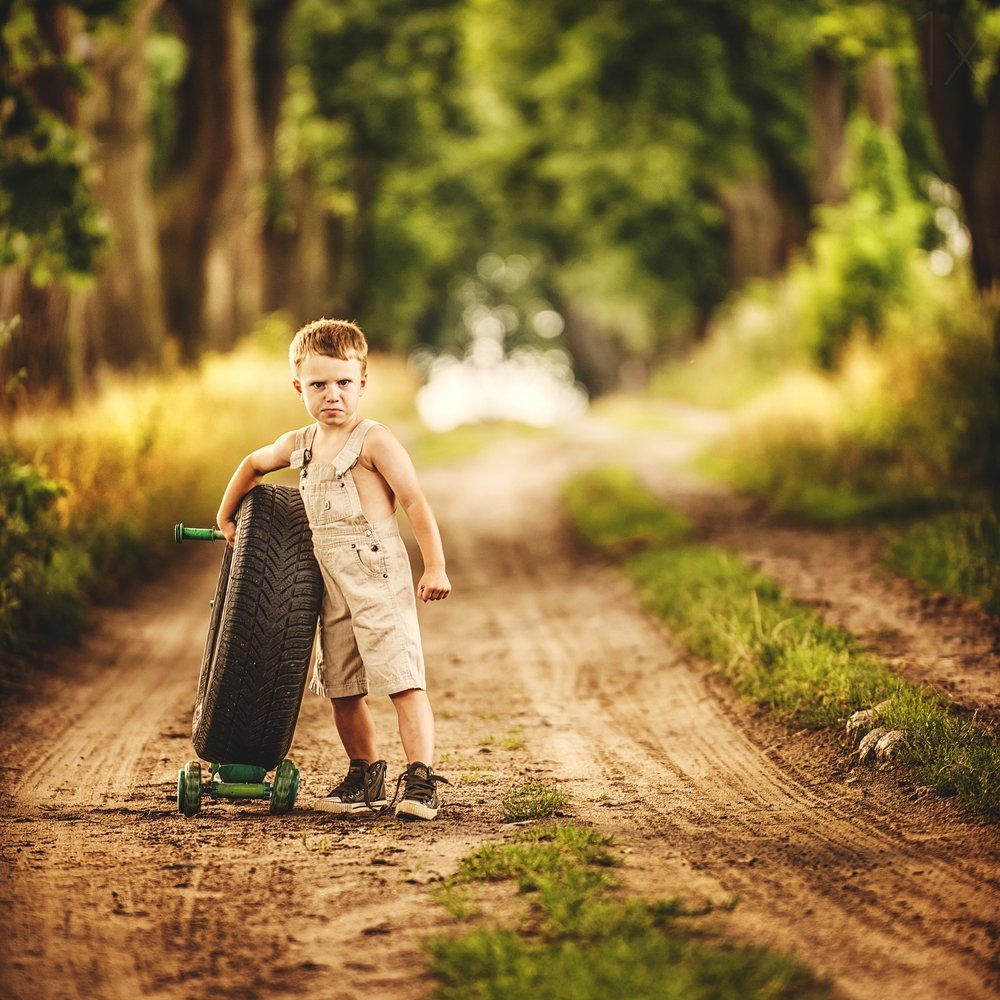 Boy with Tire Scooter