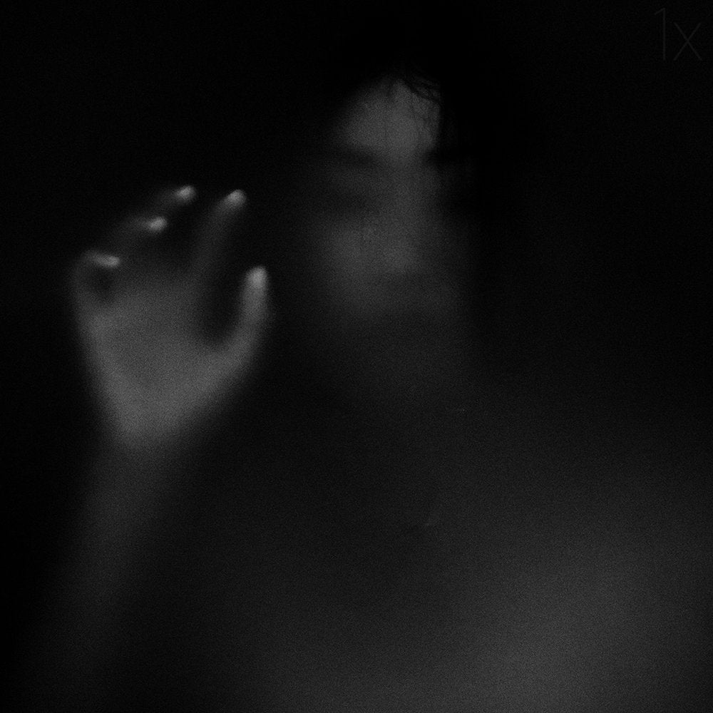 Blurred Figure Reaching