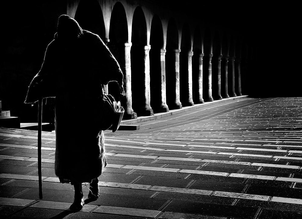 Solitary Walker Under Arches