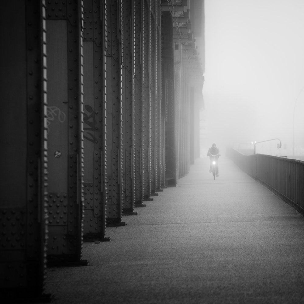 Lone Cyclist in Fog