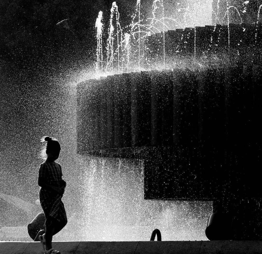 Child In Fountain Spray