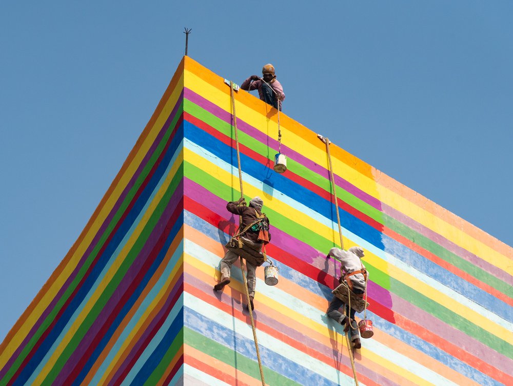 Painting Rainbow Building Stripes