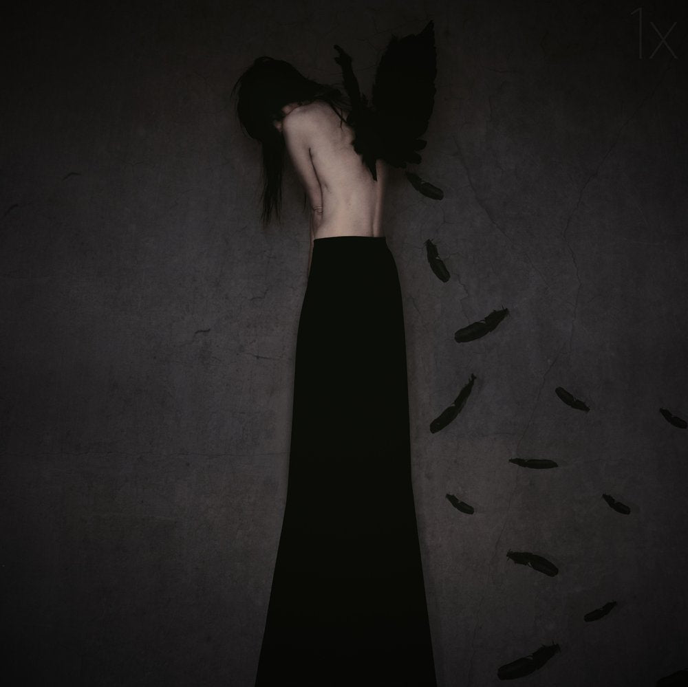 Sorrowful Winged Woman
