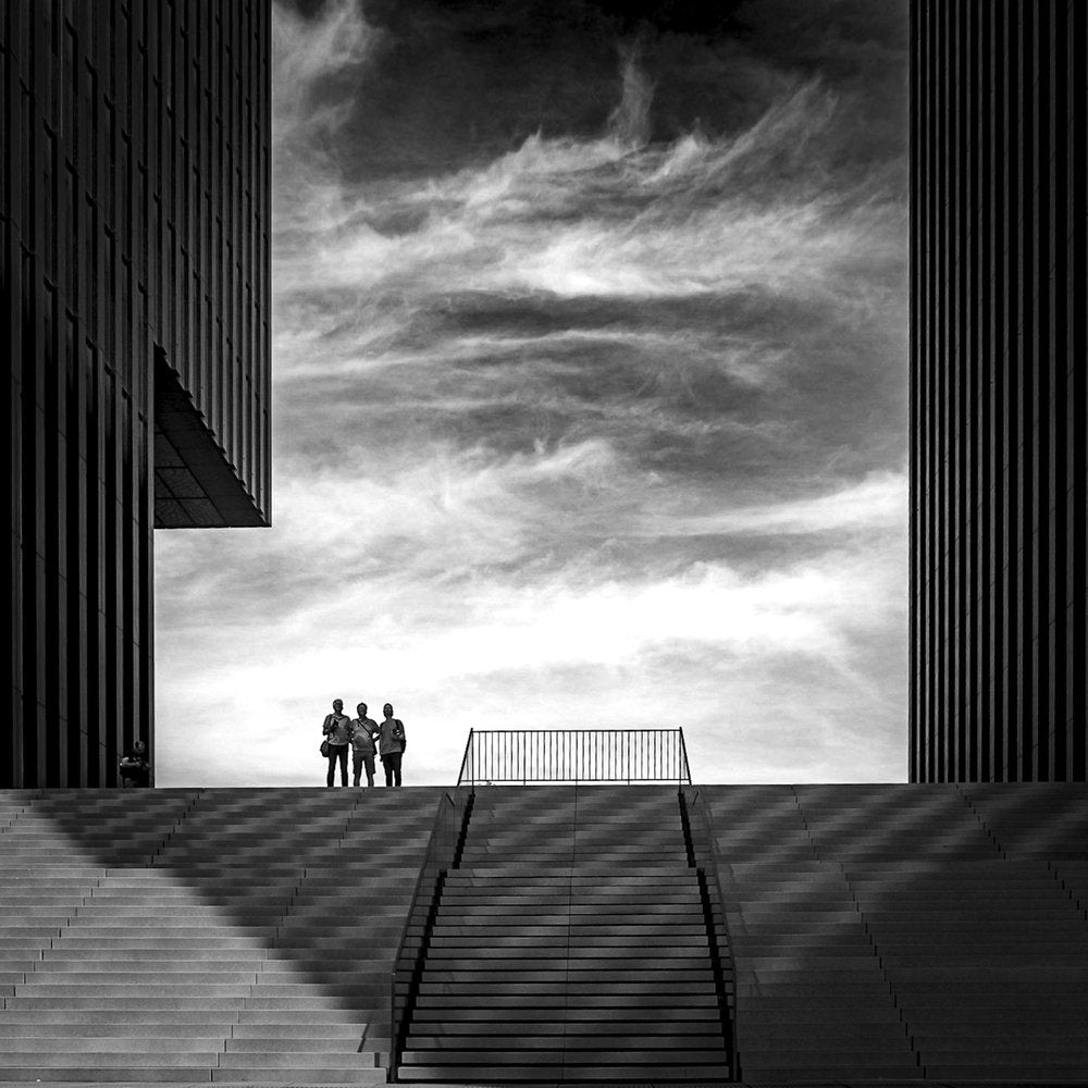 Three Figures on Stairs