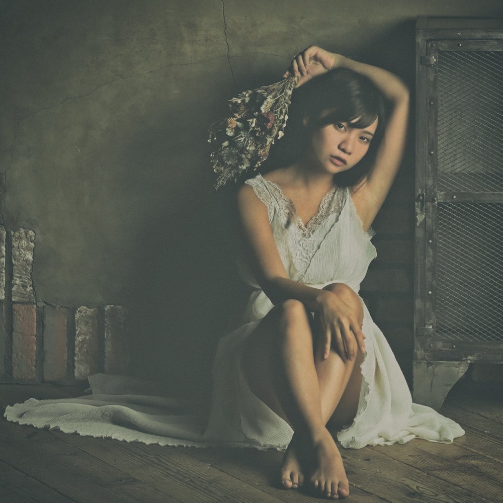 Contemplative Woman with Flowers