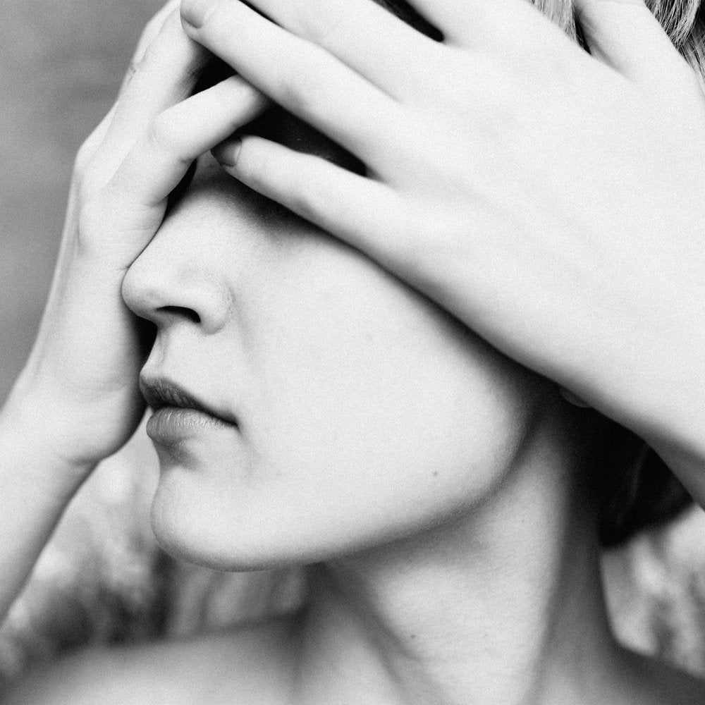 Woman Hiding Face