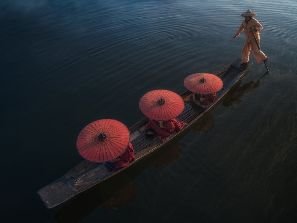 Leg Rower and Red Parasols