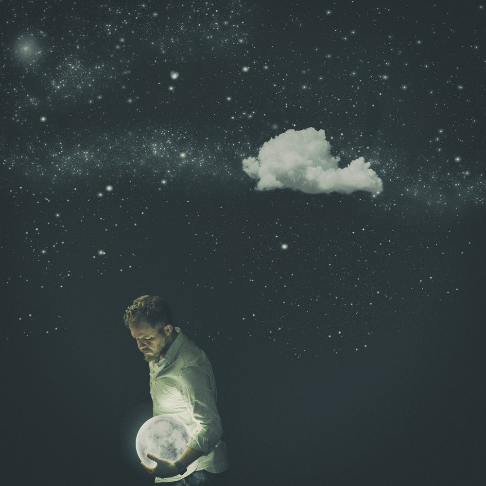 Man Holding Glowing Moon