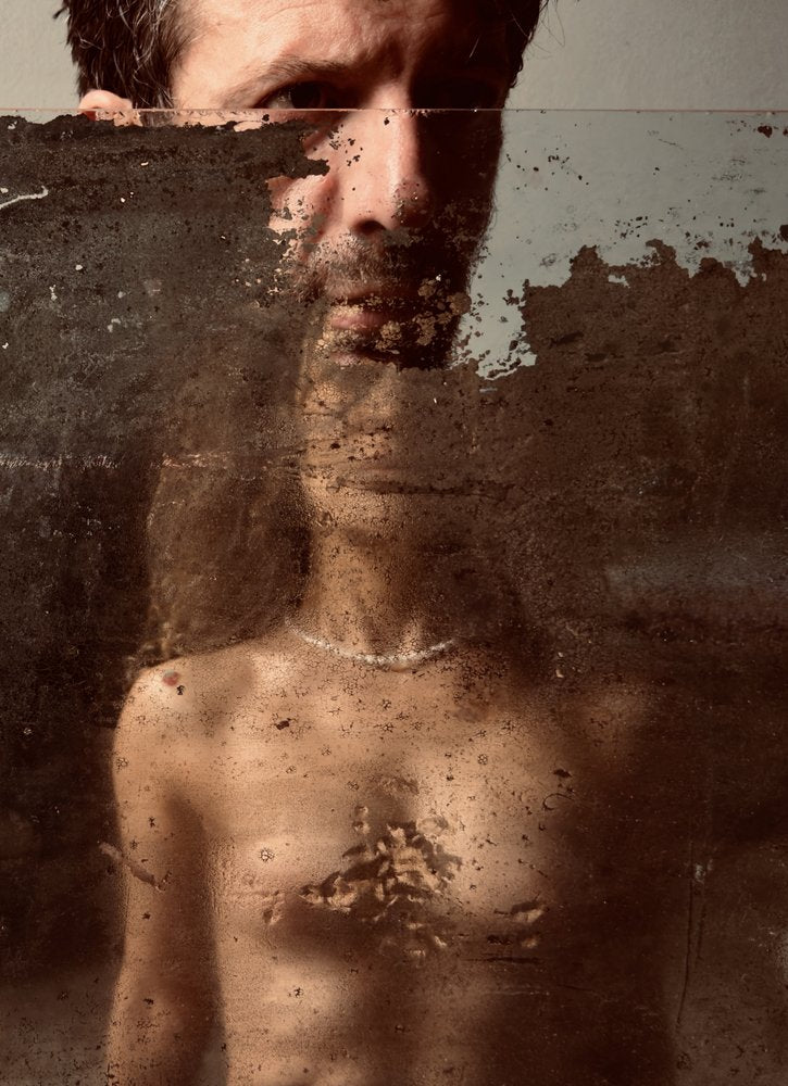 Man Behind Textured Glass