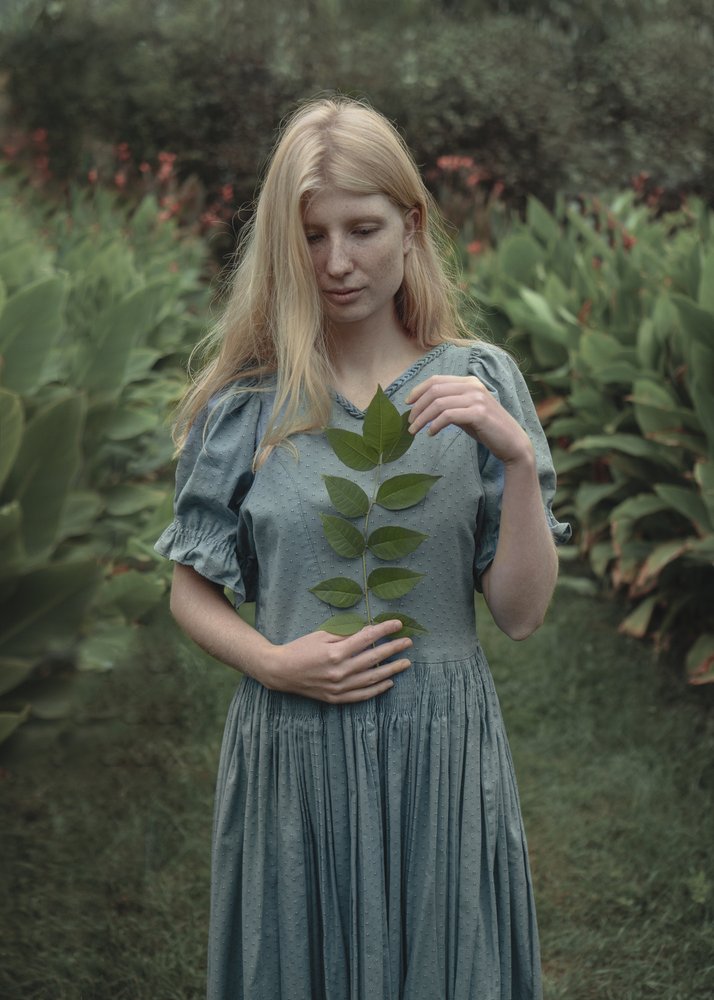 Serene Woman Green Leaves