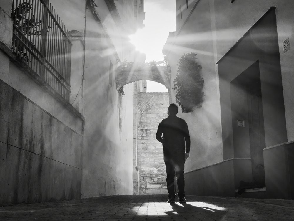 Man in Sunlit Alley